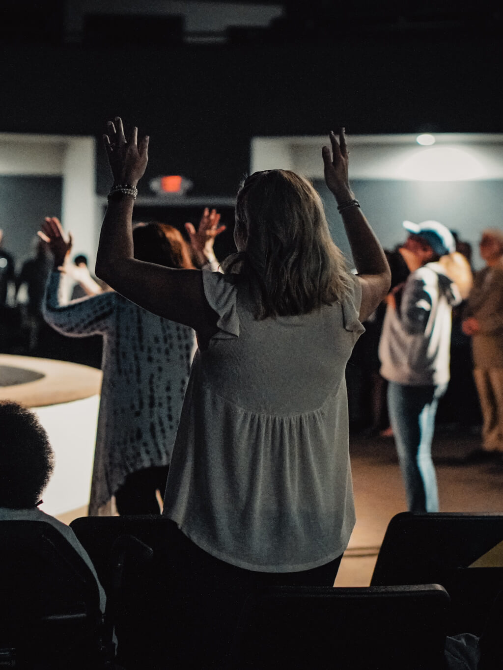 woman raising hands