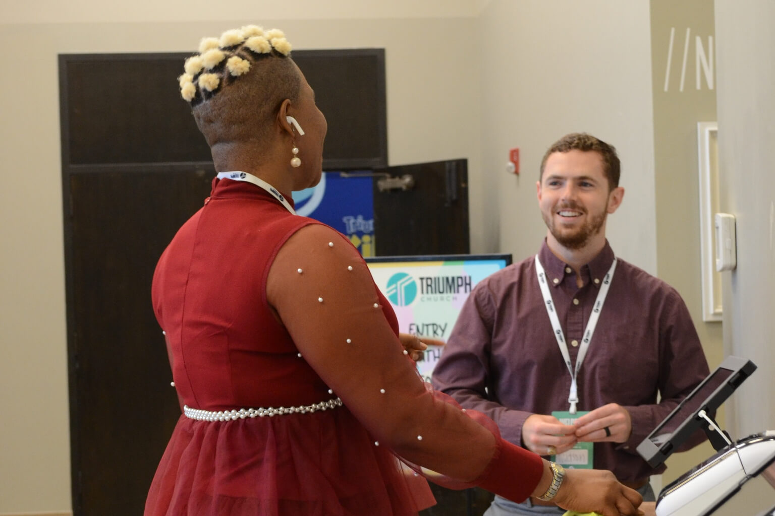 woman and man at check in station