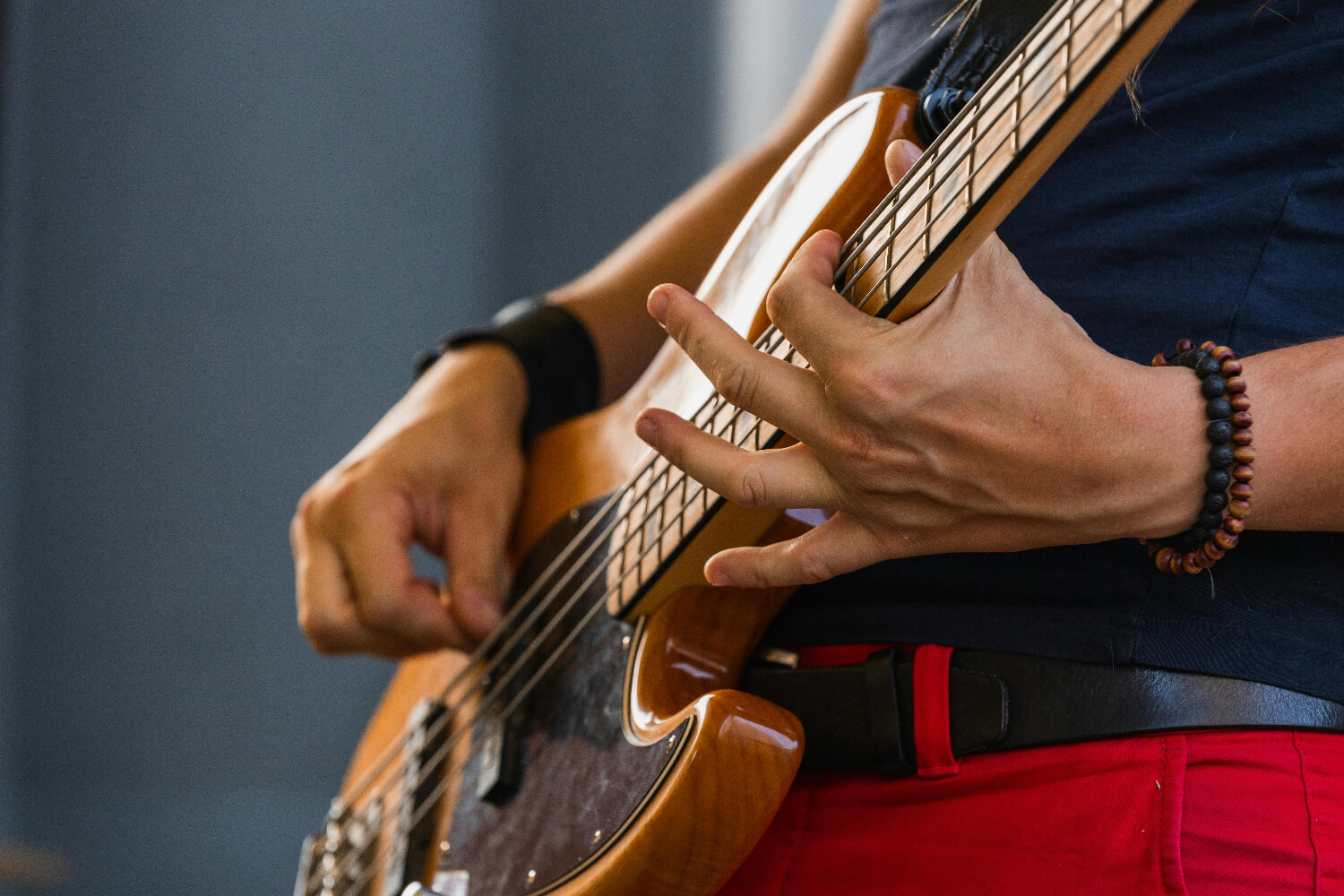  close up of person playing guitar