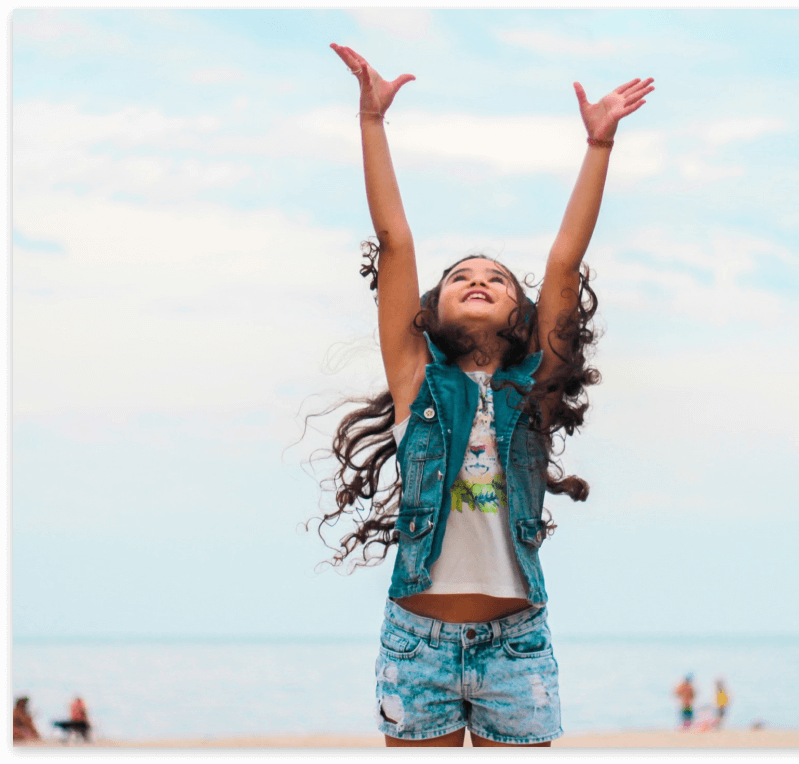 girl with hands raised